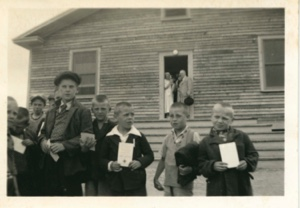 Image of group of boys and adults including nurse